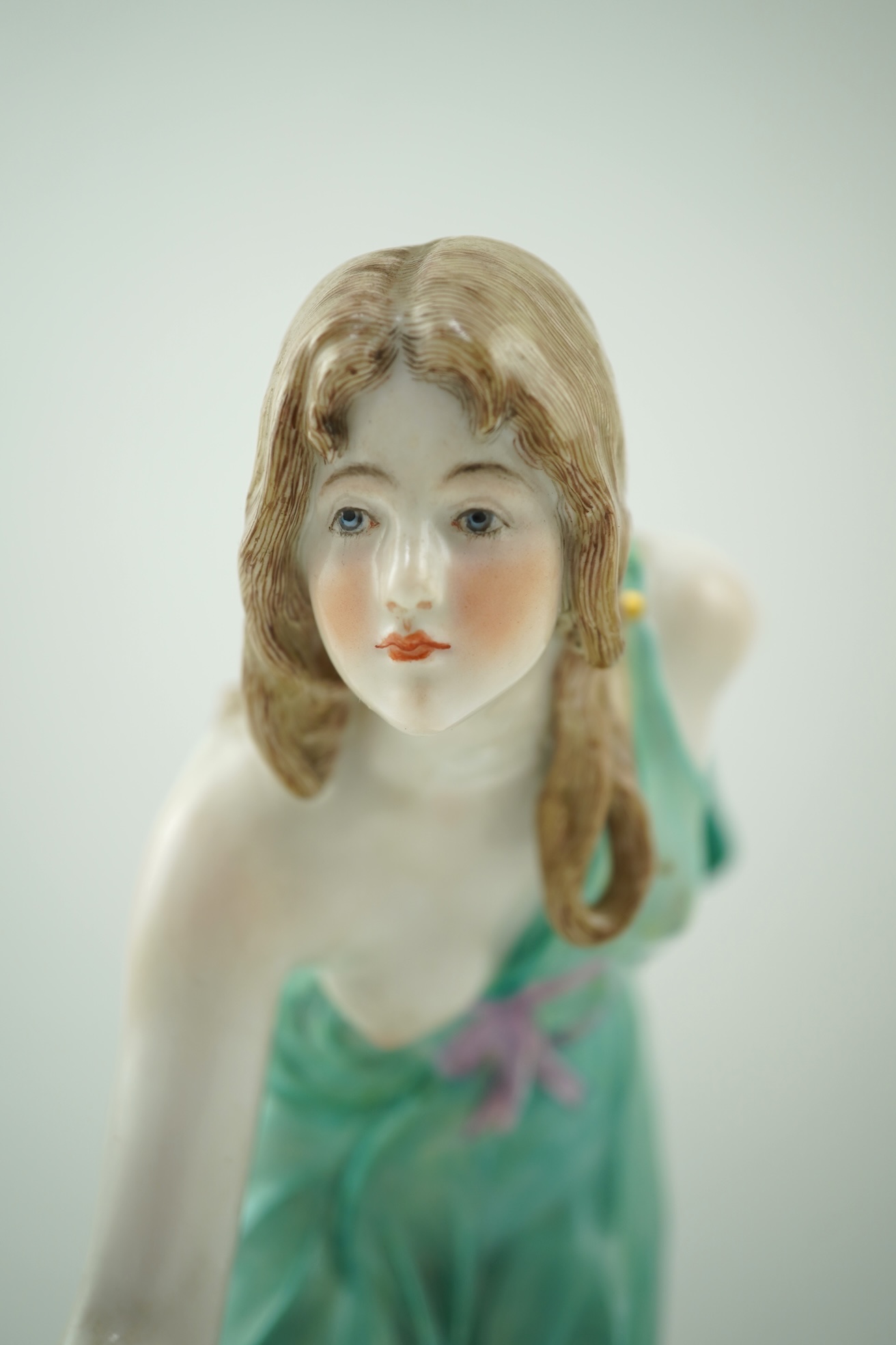 A Meissen porcelain figure, known as the 'Kugelspielerin', circa 1905, modelled by Walter Schott